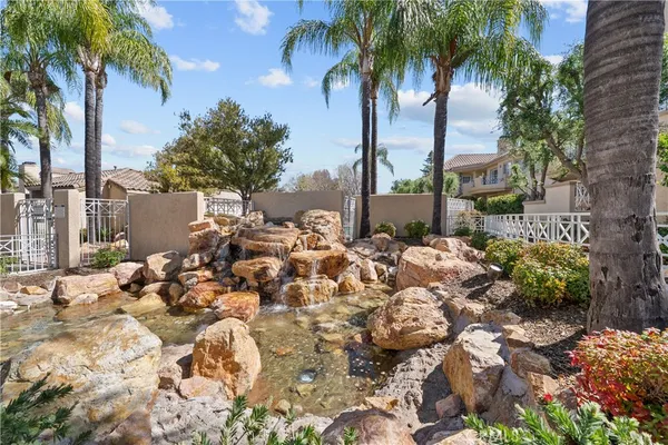 a view of a garden with a building