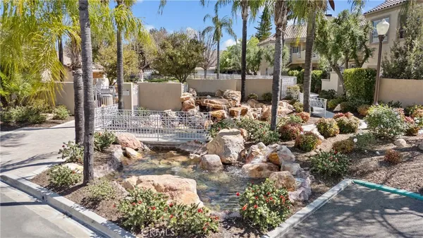 a view of a house with backyard porch and sitting area