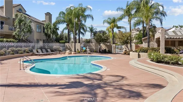 a view of a swimming pool with a patio