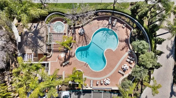 an aerial view of a swimming pool and outdoor space