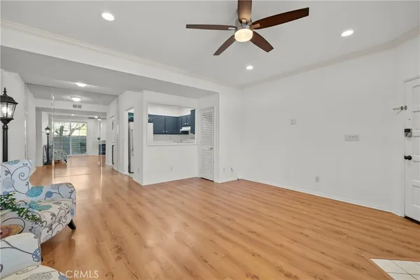 a view of a kitchen with a sink and a refrigerator