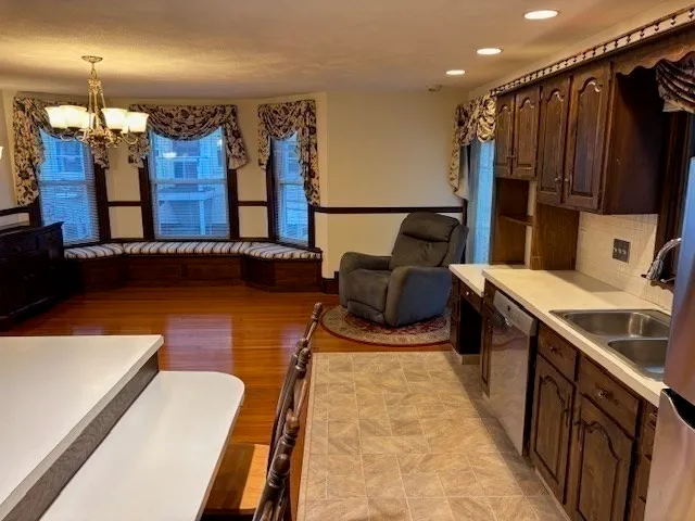 a spacious bathroom with a tub double vanity and a shower