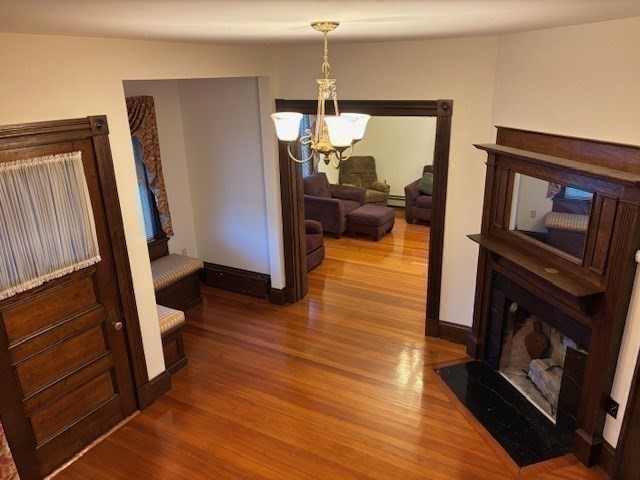 249 Lowell Street Waltham, MA 02453 - Photo 12 of 29 a view of a living room and hardwood floor