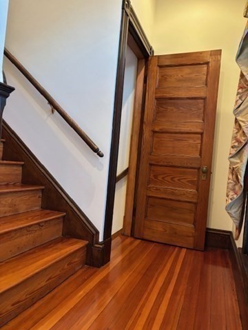 249 Lowell Street Waltham, MA 02453 - Photo 15 of 29 a view of walk in closet with stairs