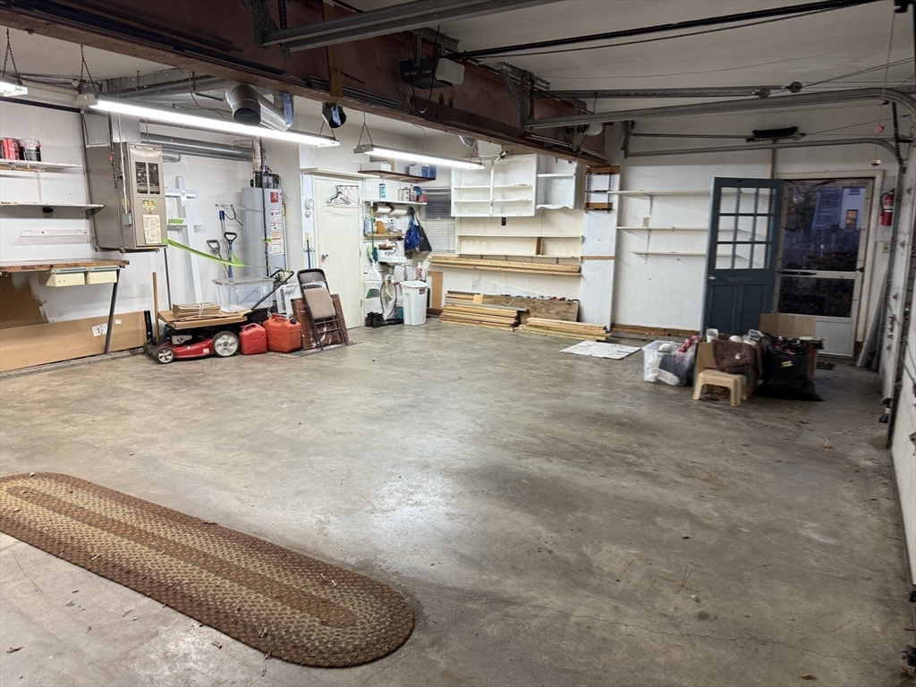 249 Lowell Street Waltham, MA 02453 - Photo 28 of 29 a view of a garage with parked cars