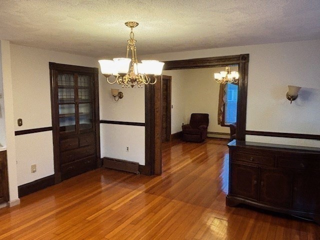 249 Lowell Street Waltham, MA 02453 - Photo 9 of 29 a view of a livingroom with a hardwood floor and a ceiling fan