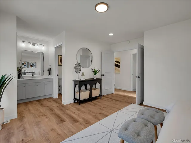 a bathroom with a double vanity sink toilet and shower
