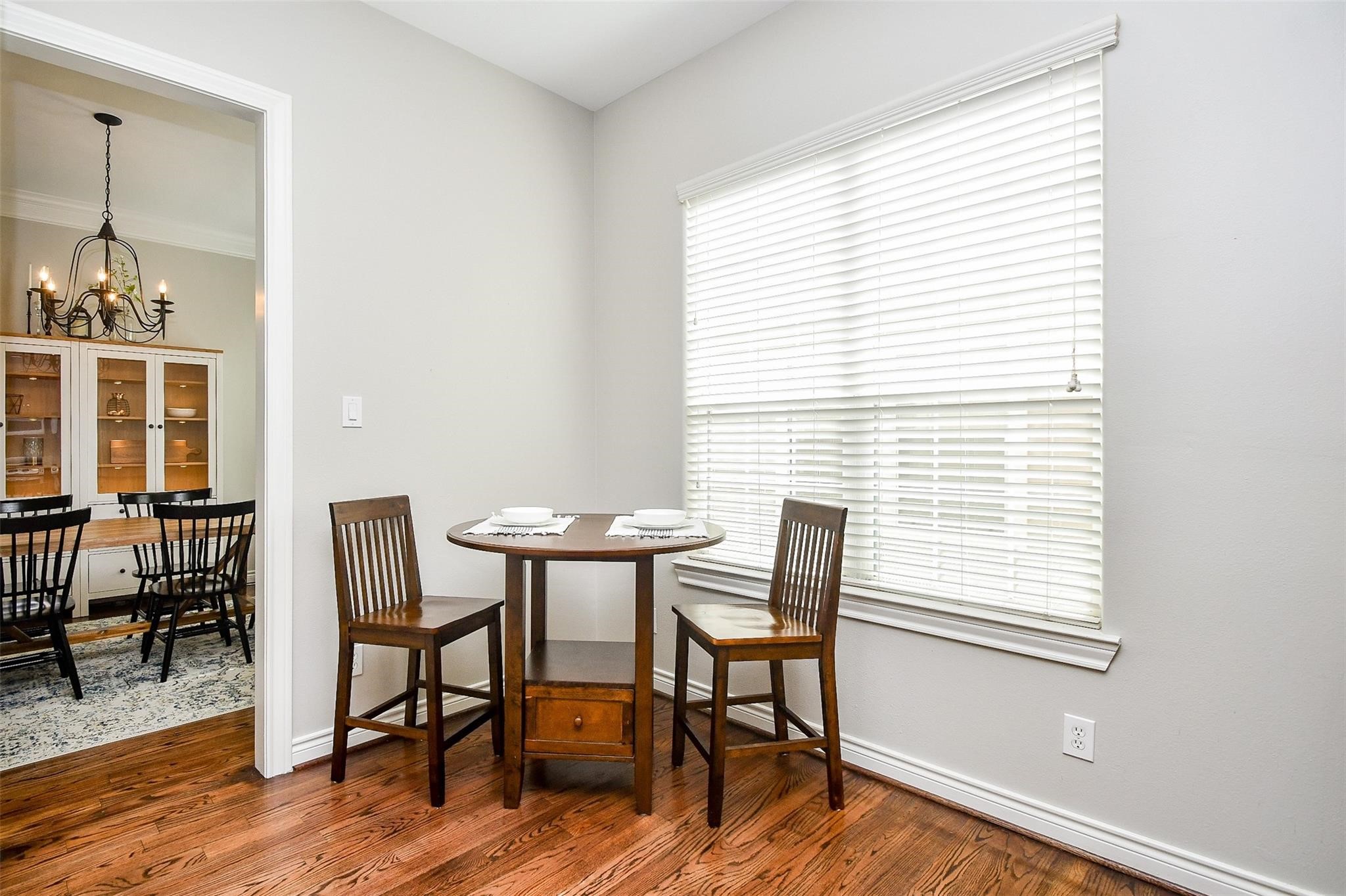2614 Maxroy Street Houston, TX 77007 - Photo 12 of 32 a view of a dining room with furniture and wooden floor