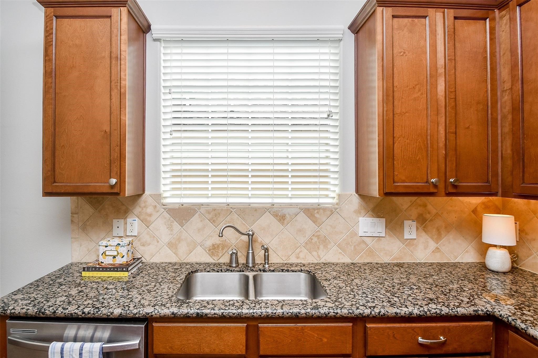 2614 Maxroy Street Houston, TX 77007 - Photo 15 of 32 a kitchen with granite countertop sink and cabinets