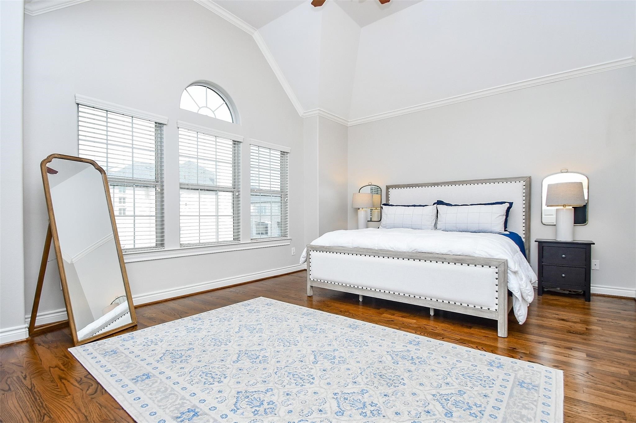 2614 Maxroy Street Houston, TX 77007 - Photo 18 of 32 a bedroom with a bed and wooden floor