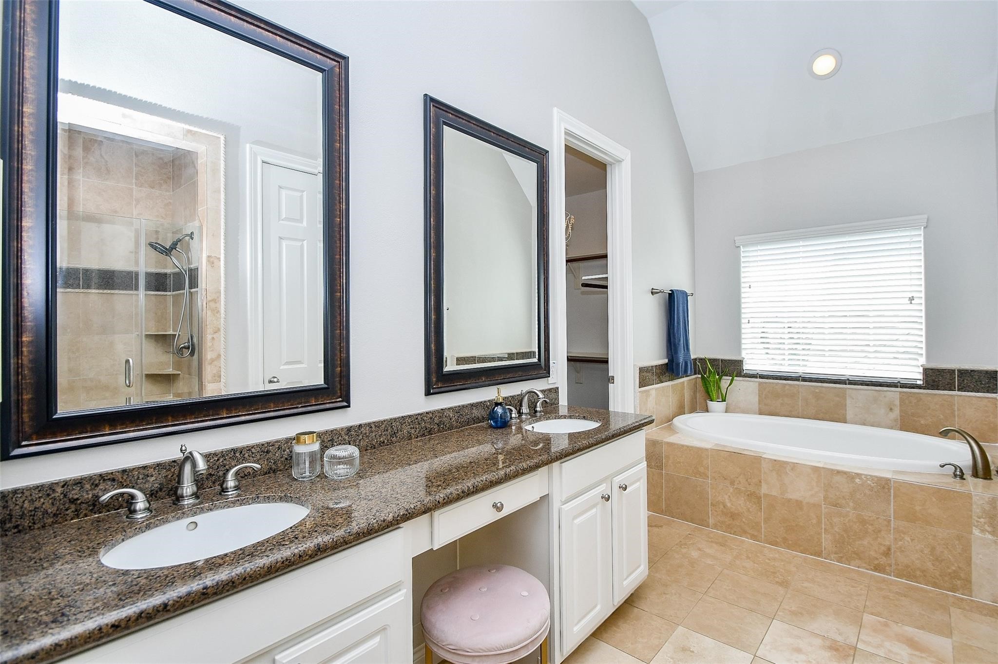 2614 Maxroy Street Houston, TX 77007 - Photo 20 of 32 a bathroom with a granite countertop tub sink and mirror