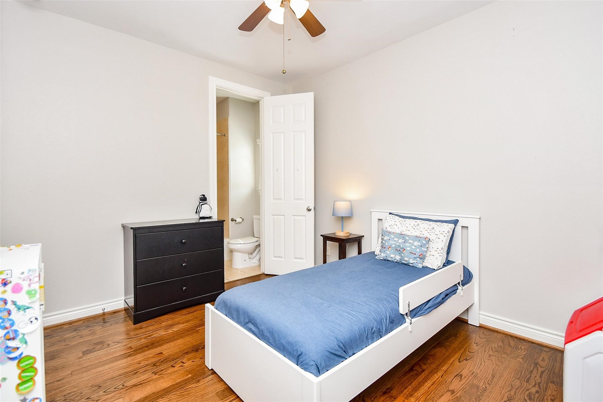 2614 Maxroy Street Houston, TX 77007 - Photo 25 of 32 a living room with a bed and a dresser