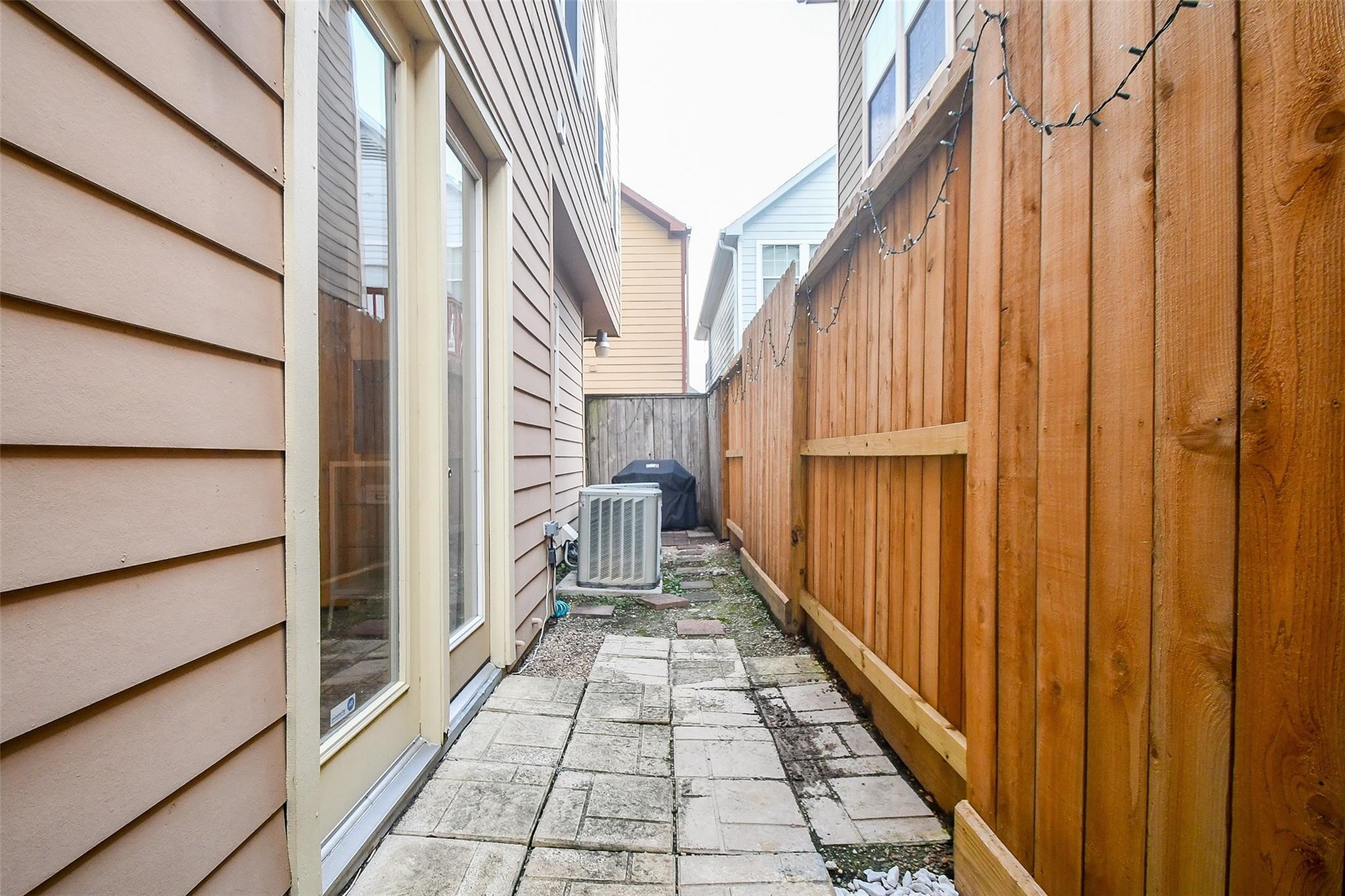 2614 Maxroy Street Houston, TX 77007 - Photo 32 of 32 a view of a balcony with wooden floor and staircase