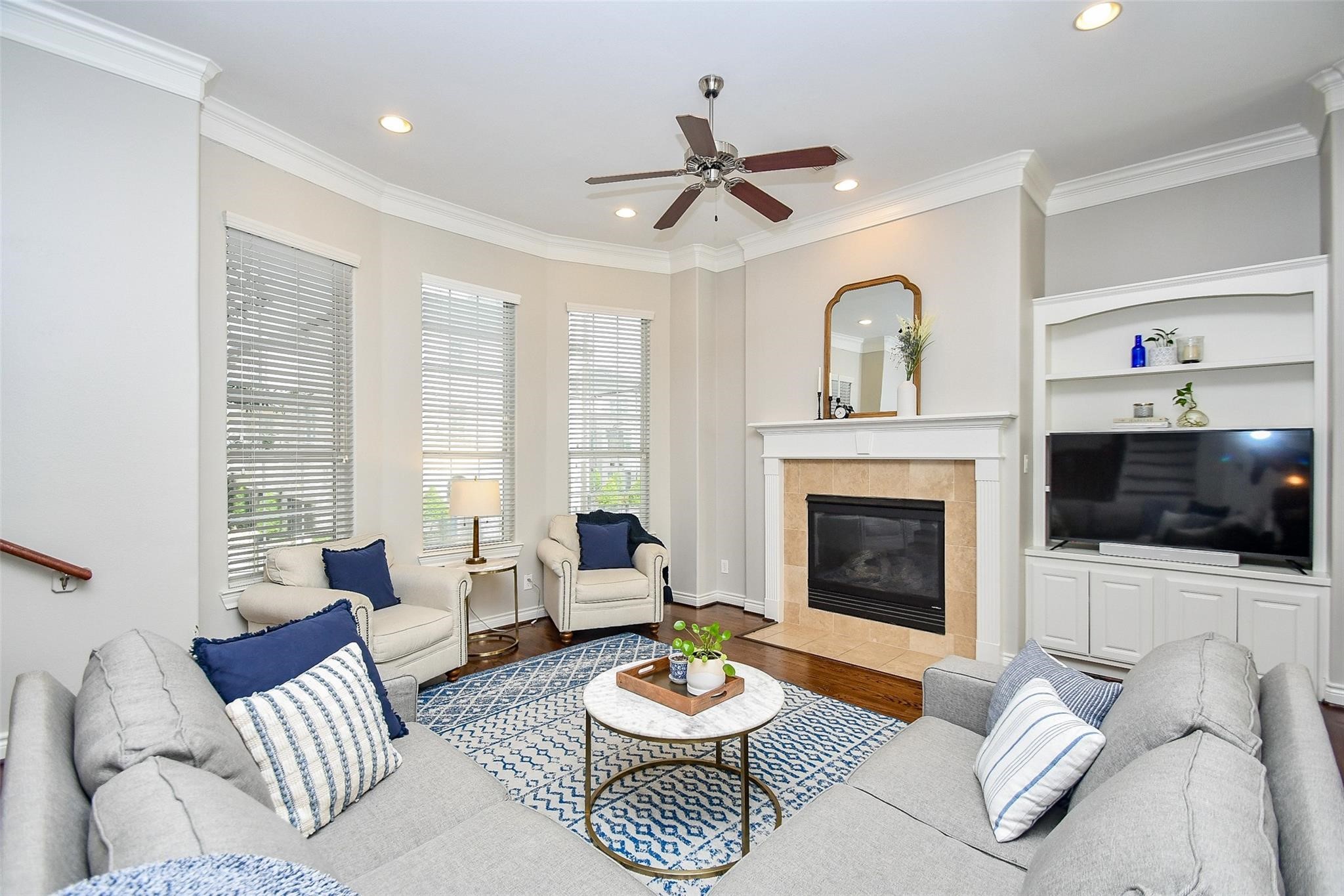 2614 Maxroy Street Houston, TX 77007 - Photo 10 of 32 a living room with furniture a fireplace and a flat screen tv