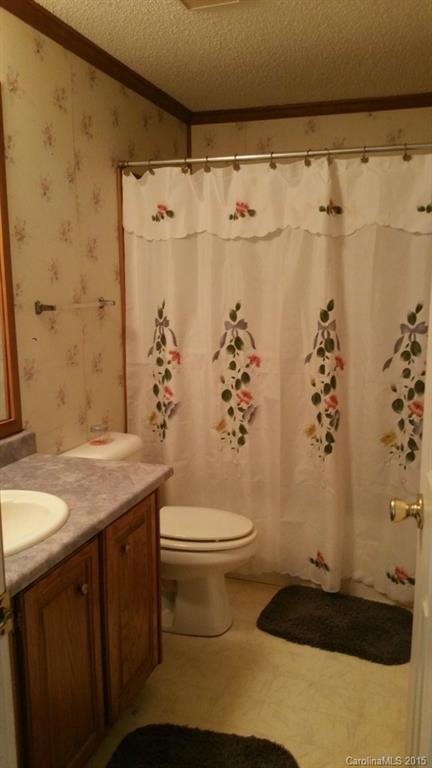 4545 Percival Road Rock Hill, SC 29730 - Photo 7 of 19 a bathroom with a granite countertop sink toilet and shower
