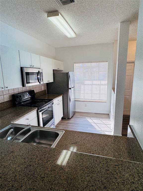 12113 Southwest 2nd Street Pembroke Pines, FL 33025 - Photo 12 of 18 a living room with a couch and a walk in closet