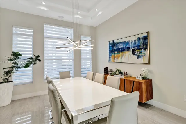 a view of a dining room with furniture and window