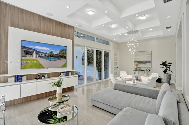 a living room with furniture kitchen and a table