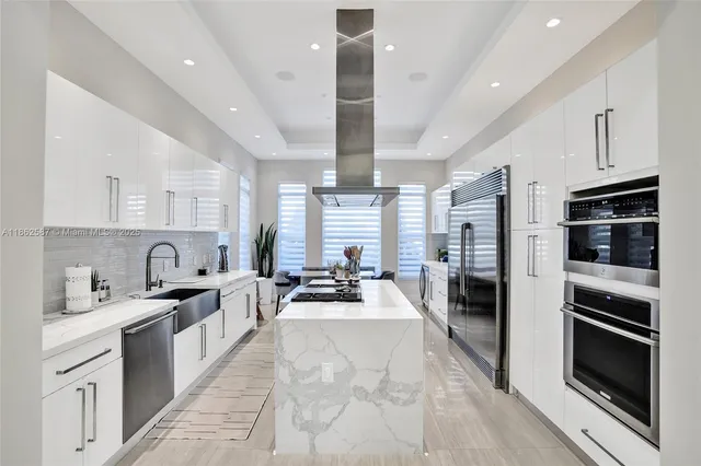 a large kitchen with kitchen island granite countertop lots of counter top space