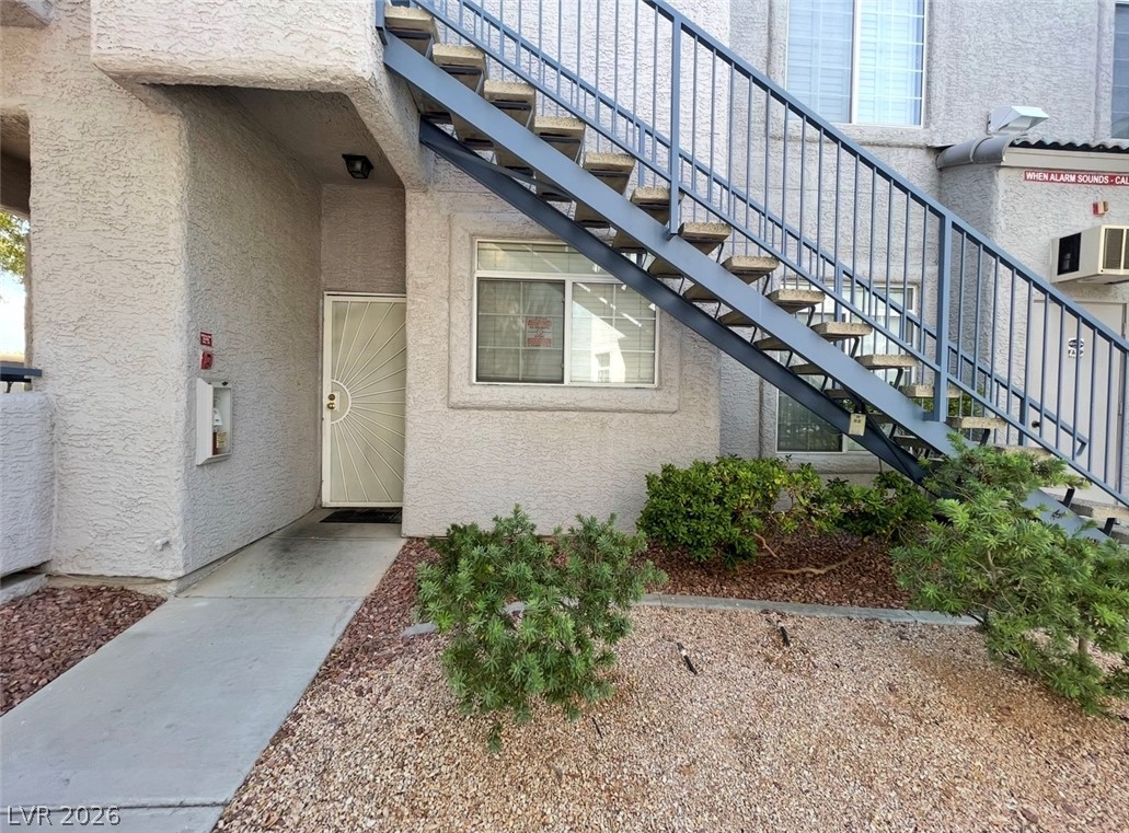 2201 Ramsgate Drive, Unit 915 Henderson, NV 89074 - Photo 4 of 36 Secure entry and convenient exterior stairs offer direct access to this well-situated residence.