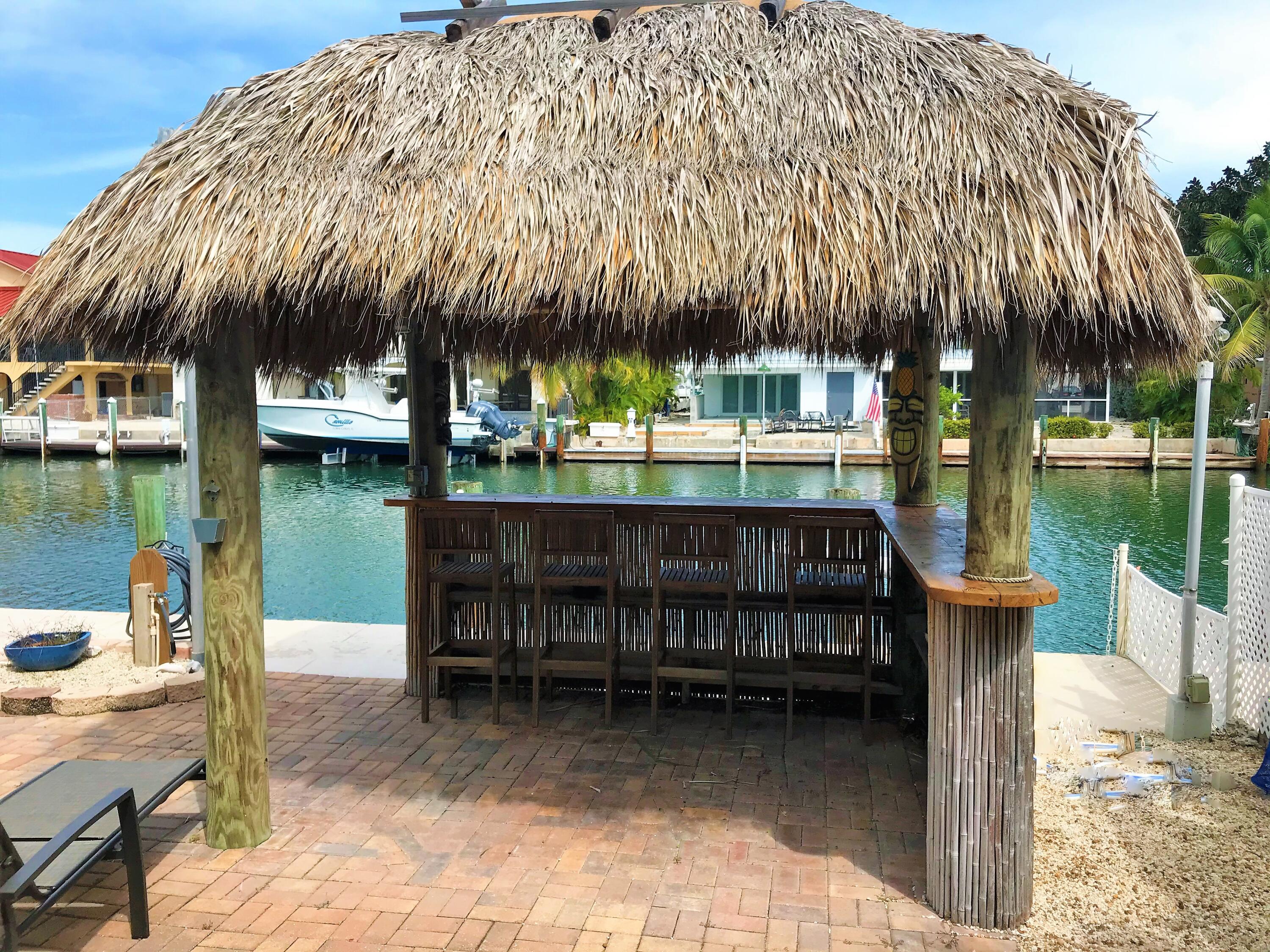 270 9th Street Key Colony Beach, FL 33051 - Photo 20 of 37 a view of a swimming pool with a patio