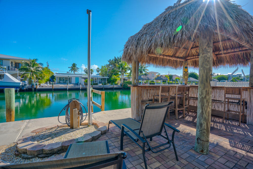 270 9th Street Key Colony Beach, FL 33051 - Photo 22 of 37 a view of a table and chairs in patio