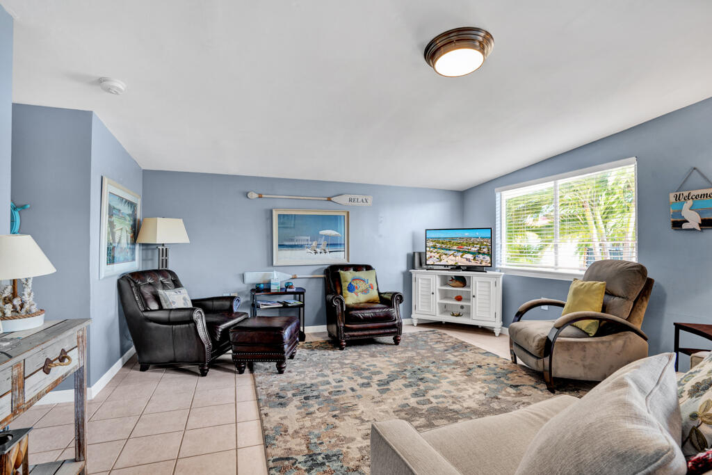 270 9th Street Key Colony Beach, FL 33051 - Photo 4 of 37 a living room with furniture and a flat screen tv