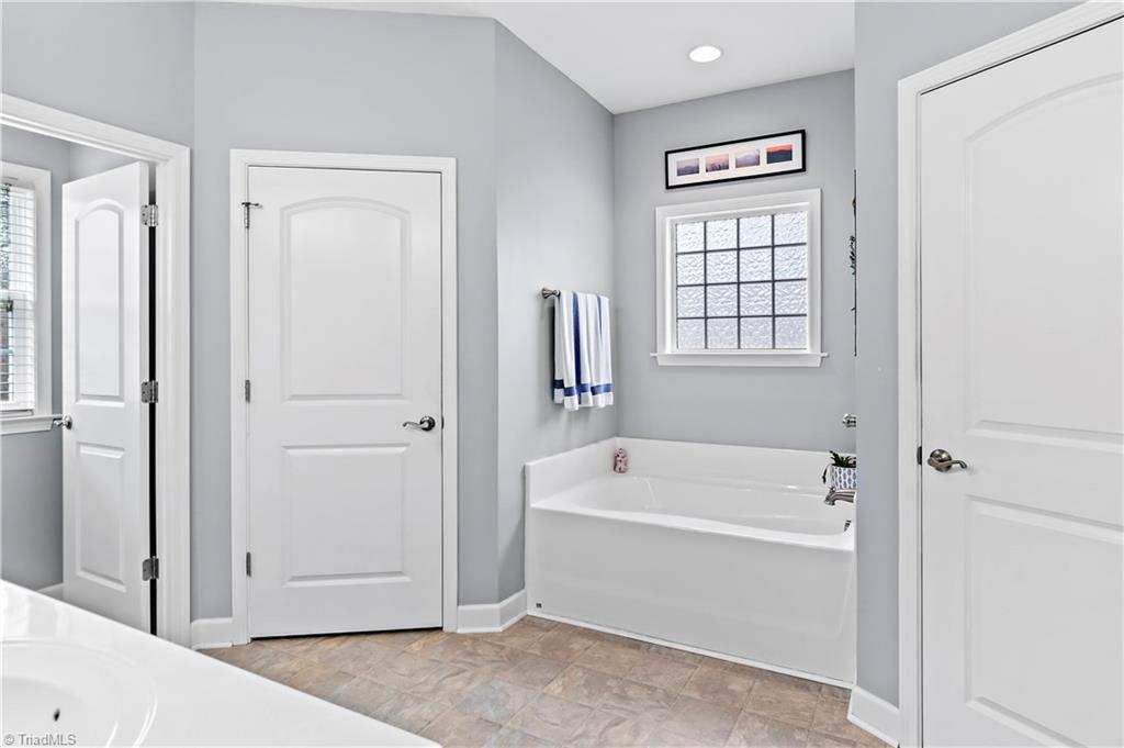 2151 Hickory Tree Road Winston-Salem, NC 27127 - Photo 17 of 31 Primary bathroom with tub and separate shower - as well as welk in closet
