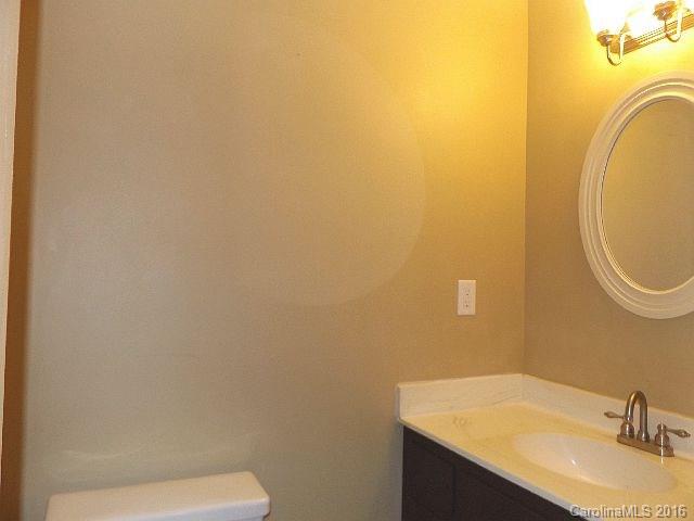 27076 Catamaran Drive Tega Cay, SC 29708 - Photo 13 of 22 a bathroom with a sink and a mirror