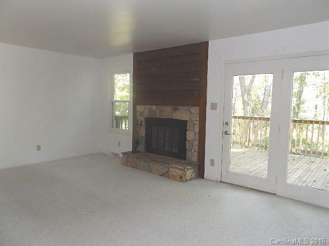 27076 Catamaran Drive Tega Cay, SC 29708 - Photo 3 of 22 an empty room with a fireplace
