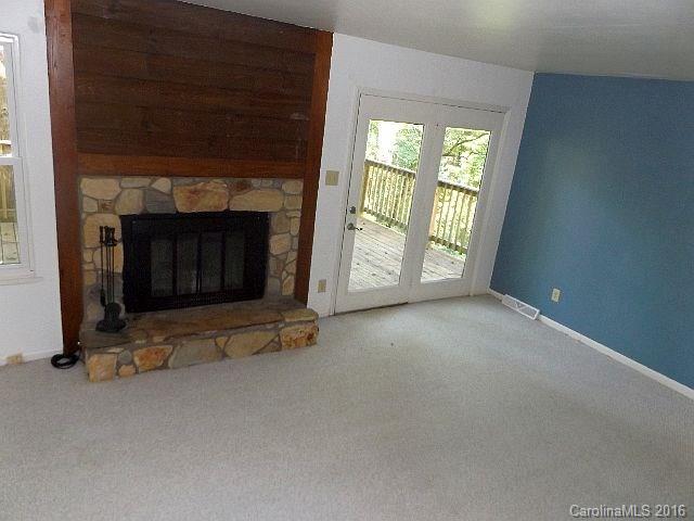 27076 Catamaran Drive Tega Cay, SC 29708 - Photo 4 of 22 a view of an empty room with a fireplace