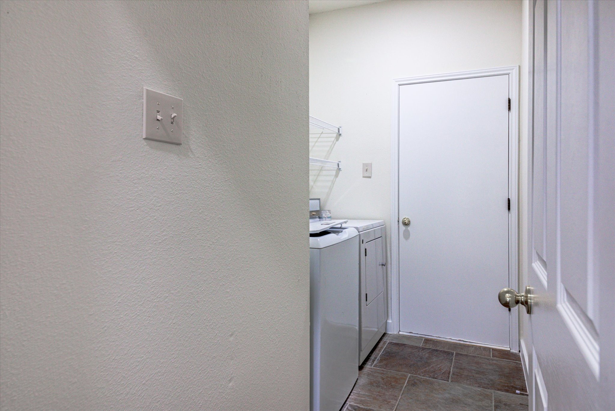 6301 Thirlmare Court Austin, TX 78754 - Photo 34 of 40 Easy access to the main floor laundry. Washer & Dryer are available for sale, too.