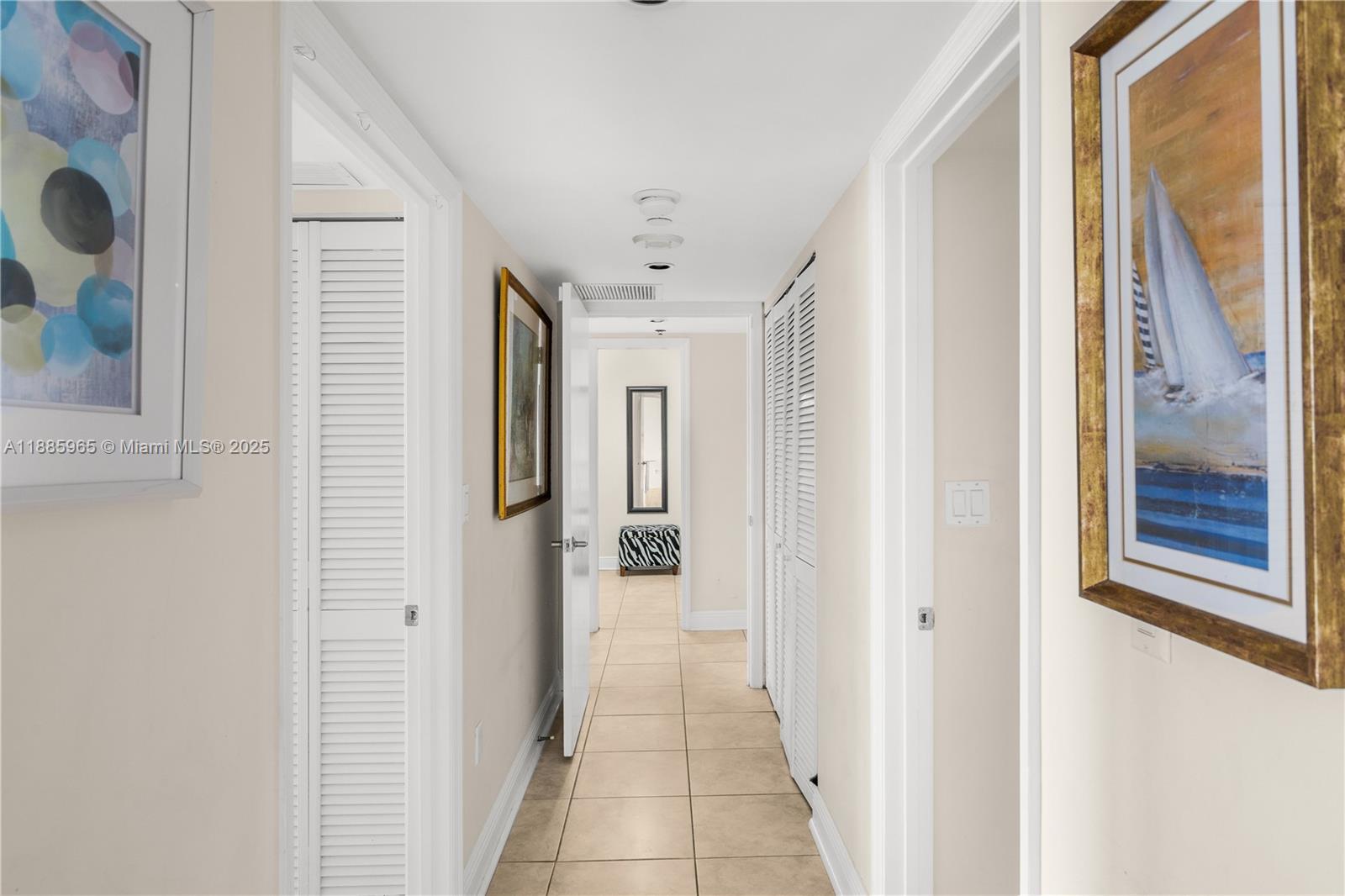 6917 Collins Avenue, Unit 1505 Miami Beach, FL 33141 - Photo 20 of 53 a view of a hallway with wooden floor and windows