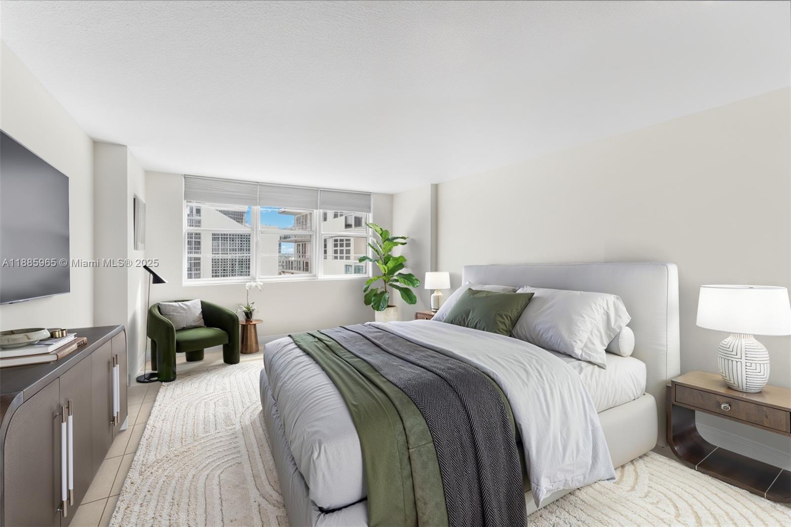 6917 Collins Avenue, Unit 1505 Miami Beach, FL 33141 - Photo 21 of 53 a bedroom with a bed and a couch