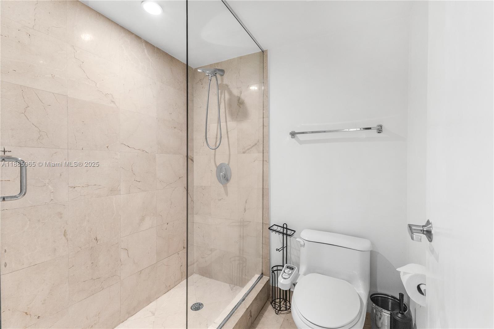 6917 Collins Avenue, Unit 1505 Miami Beach, FL 33141 - Photo 27 of 53 a bathroom with a toilet and a shower