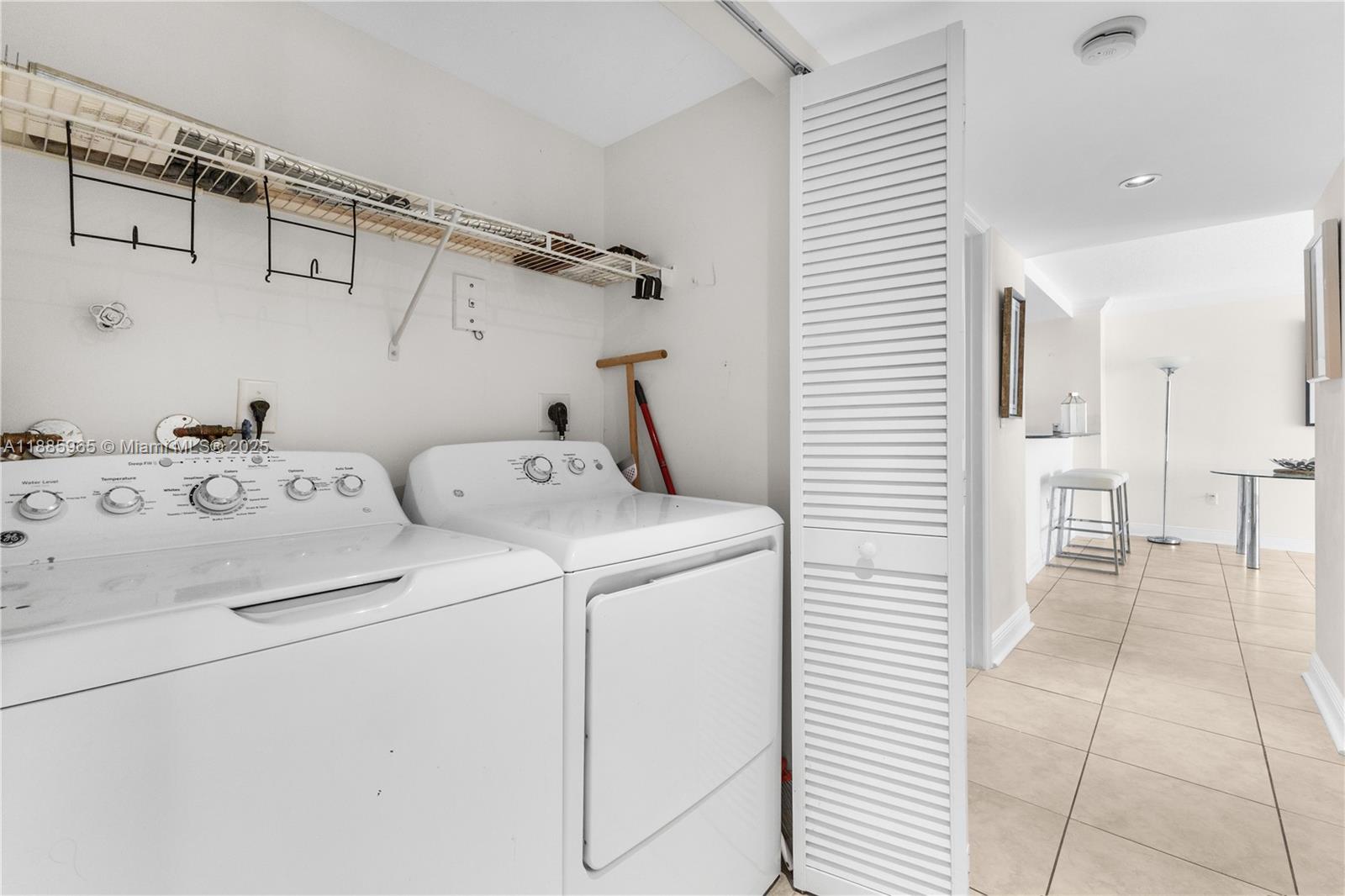 6917 Collins Avenue, Unit 1505 Miami Beach, FL 33141 - Photo 29 of 53 a utility room with dryer and washer