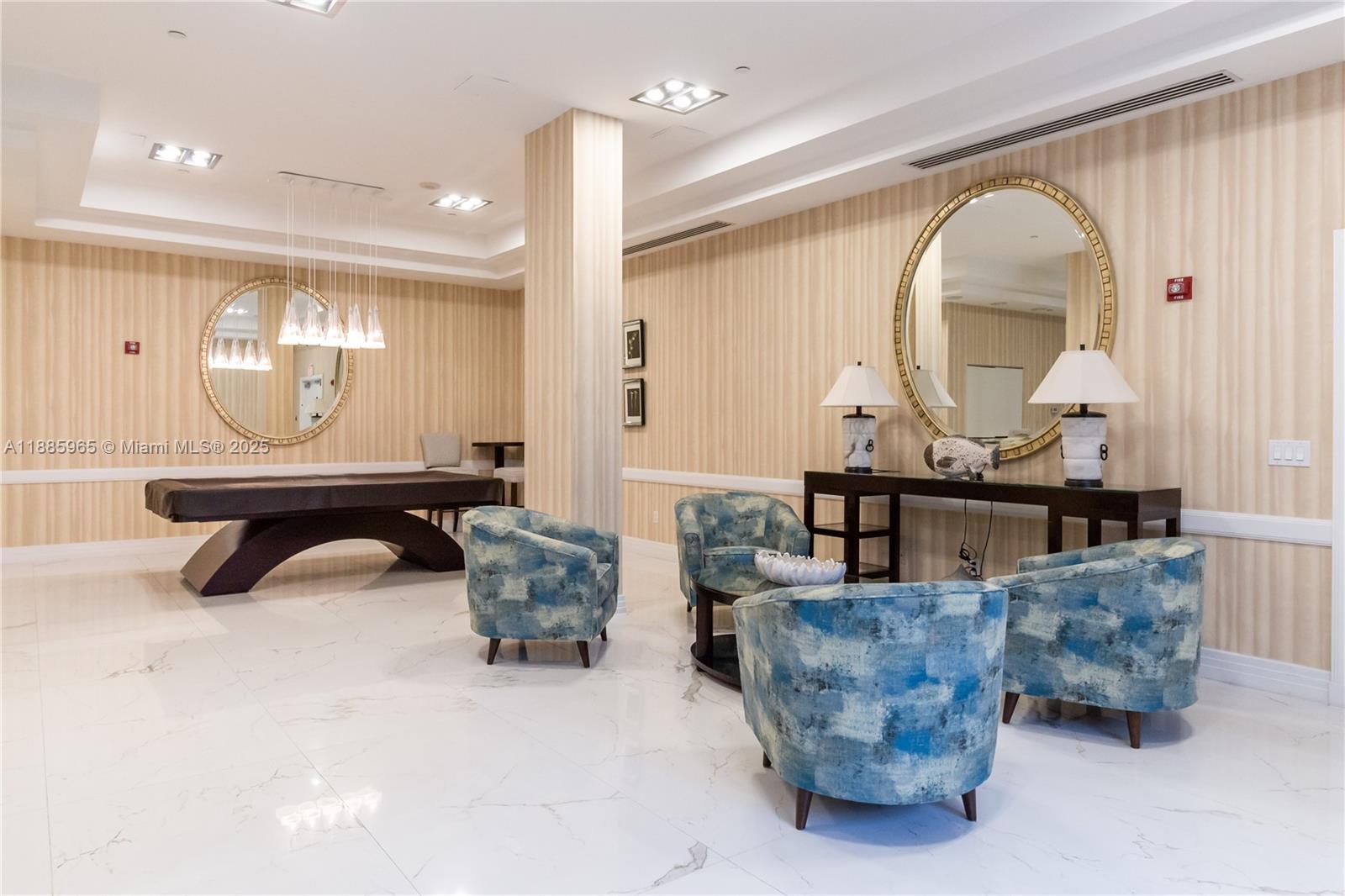 6917 Collins Avenue, Unit 1505 Miami Beach, FL 33141 - Photo 43 of 53 a living room with furniture and a mirror