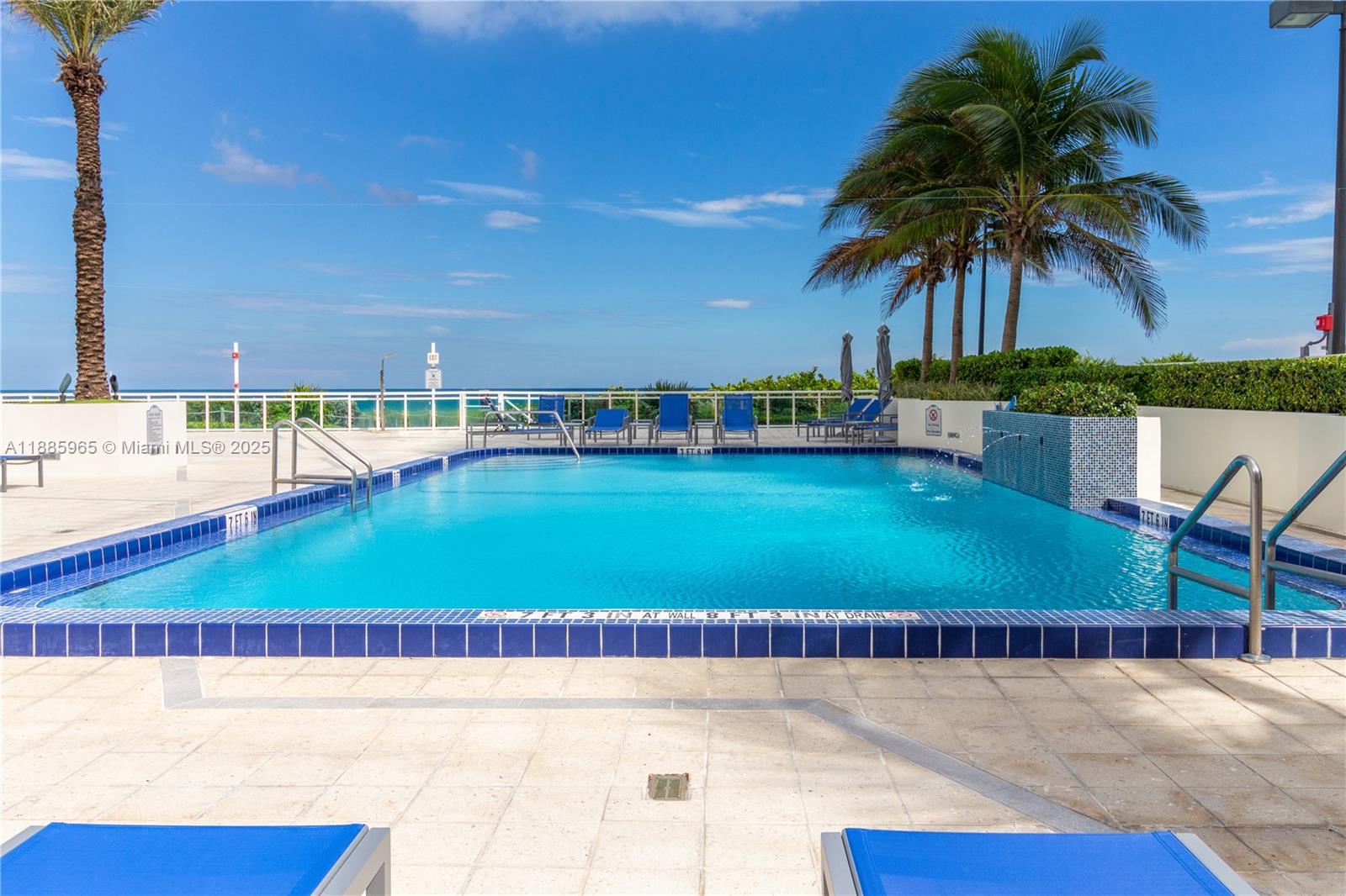 6917 Collins Avenue, Unit 1505 Miami Beach, FL 33141 - Photo 48 of 53 a view of swimming pool with outdoor seating and lake view