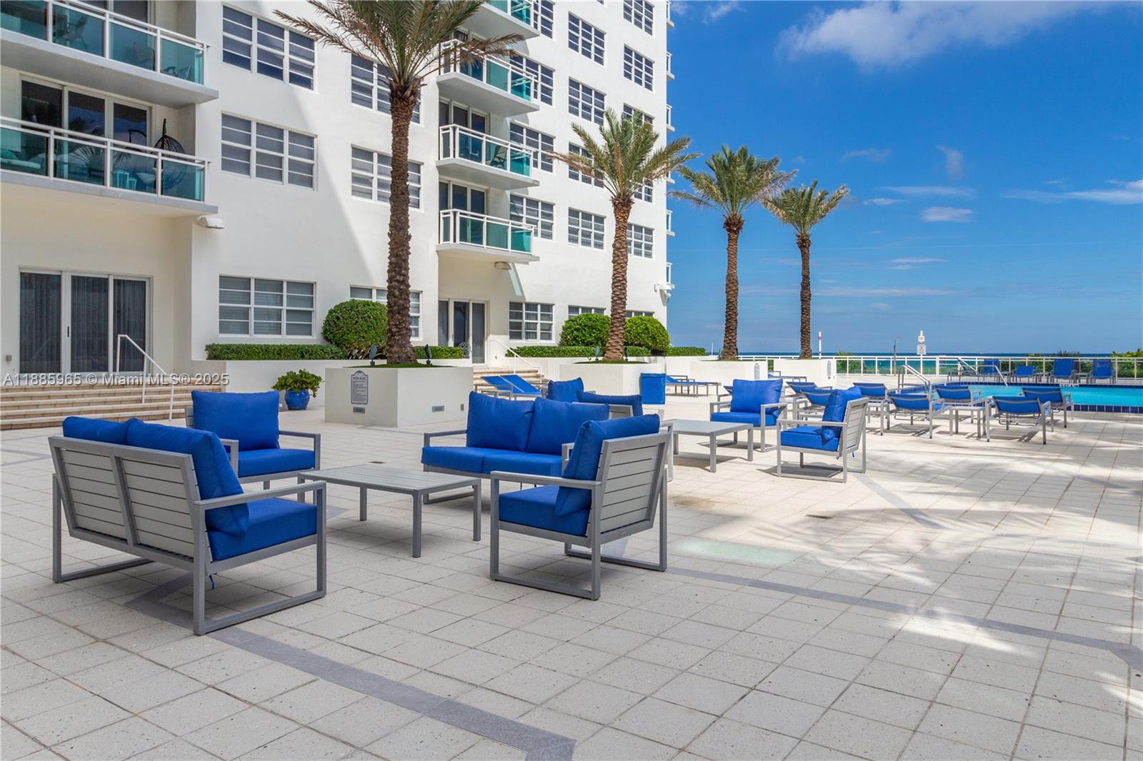6917 Collins Avenue, Unit 1505 Miami Beach, FL 33141 - Photo 49 of 53 a building outdoor space with patio furniture and potted plants