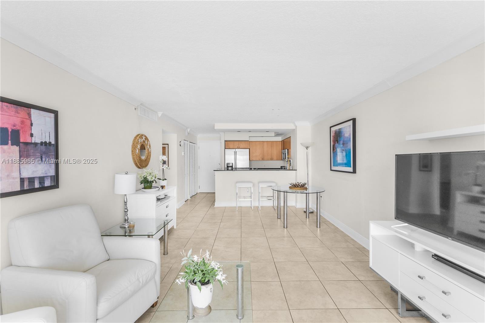 6917 Collins Avenue, Unit 1505 Miami Beach, FL 33141 - Photo 7 of 53 a living room with furniture and wooden floor