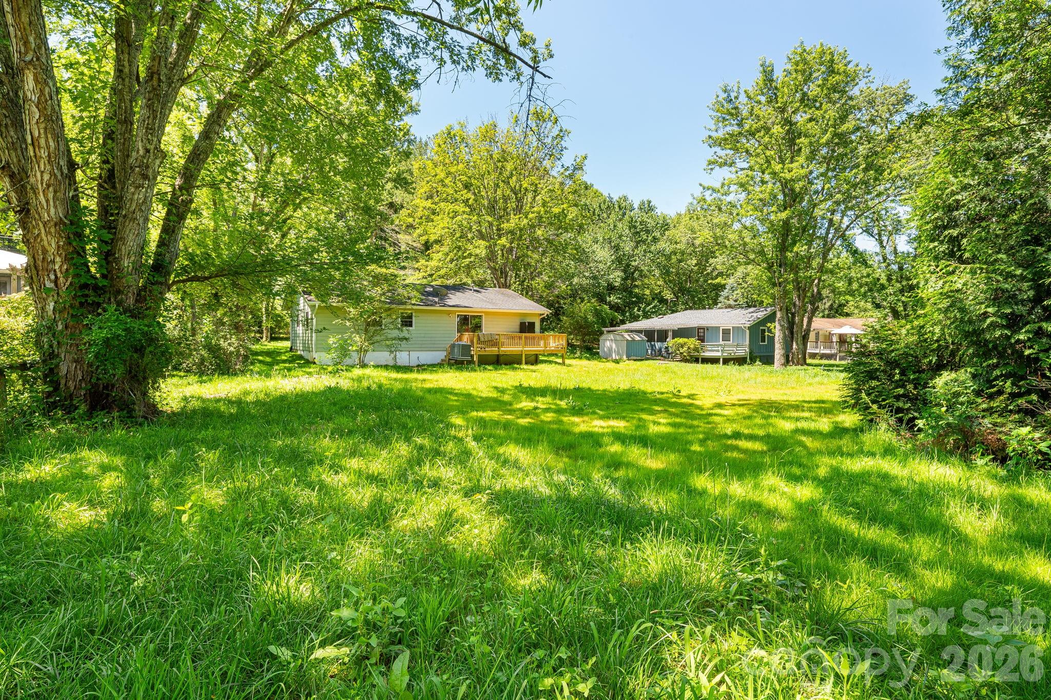 468 Beaverdam Road Asheville, NC 28804 - Photo 4 of 19 a view of a backyard with swimming pool