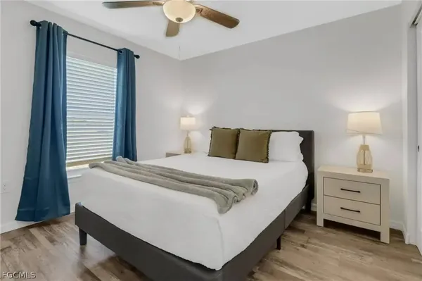 a bedroom with a bed and a dresser