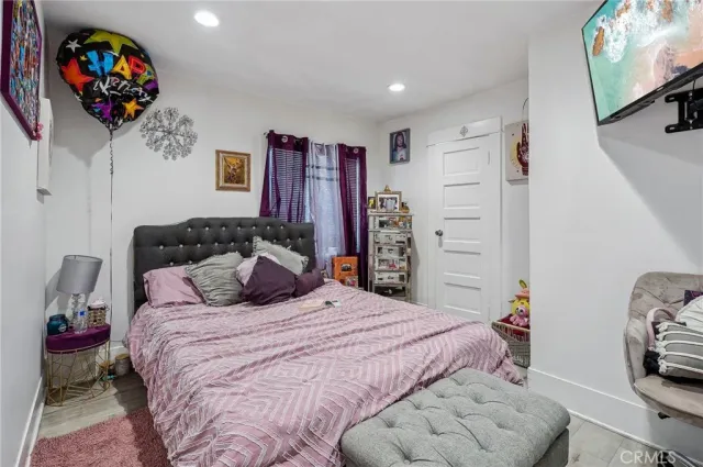 a bedroom with a bed and a bookshelf