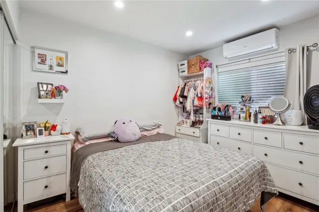 a bedroom with a bed and a couch