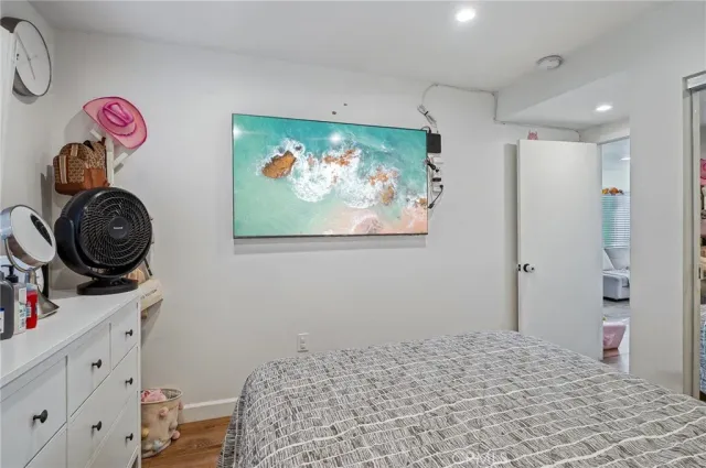 a bedroom with a bed and a fish tank