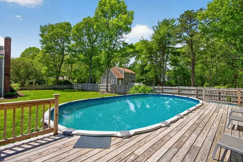 a view of backyard with a garden and entertaining space
