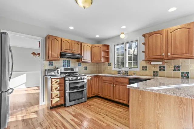 a bathroom with a sink mirror and toilet