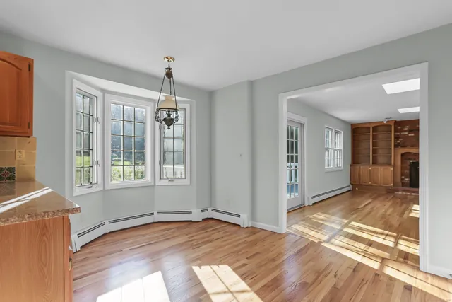 a bedroom with a large bed and a flat screen tv