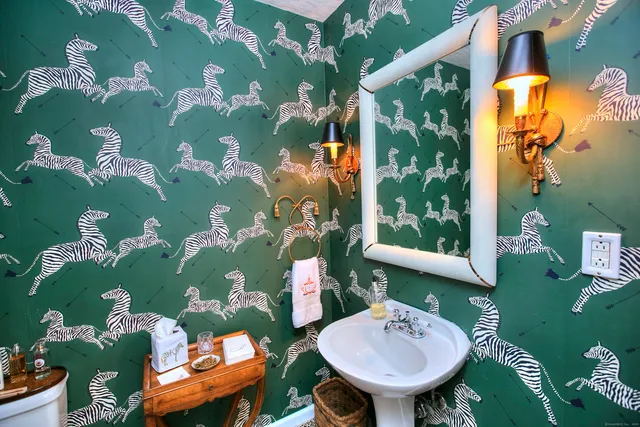 a en suite bathroom with a sink double vanity and mirror