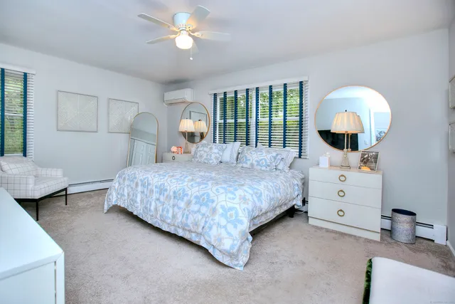 a bathroom with a sink vanity granite tub and shower